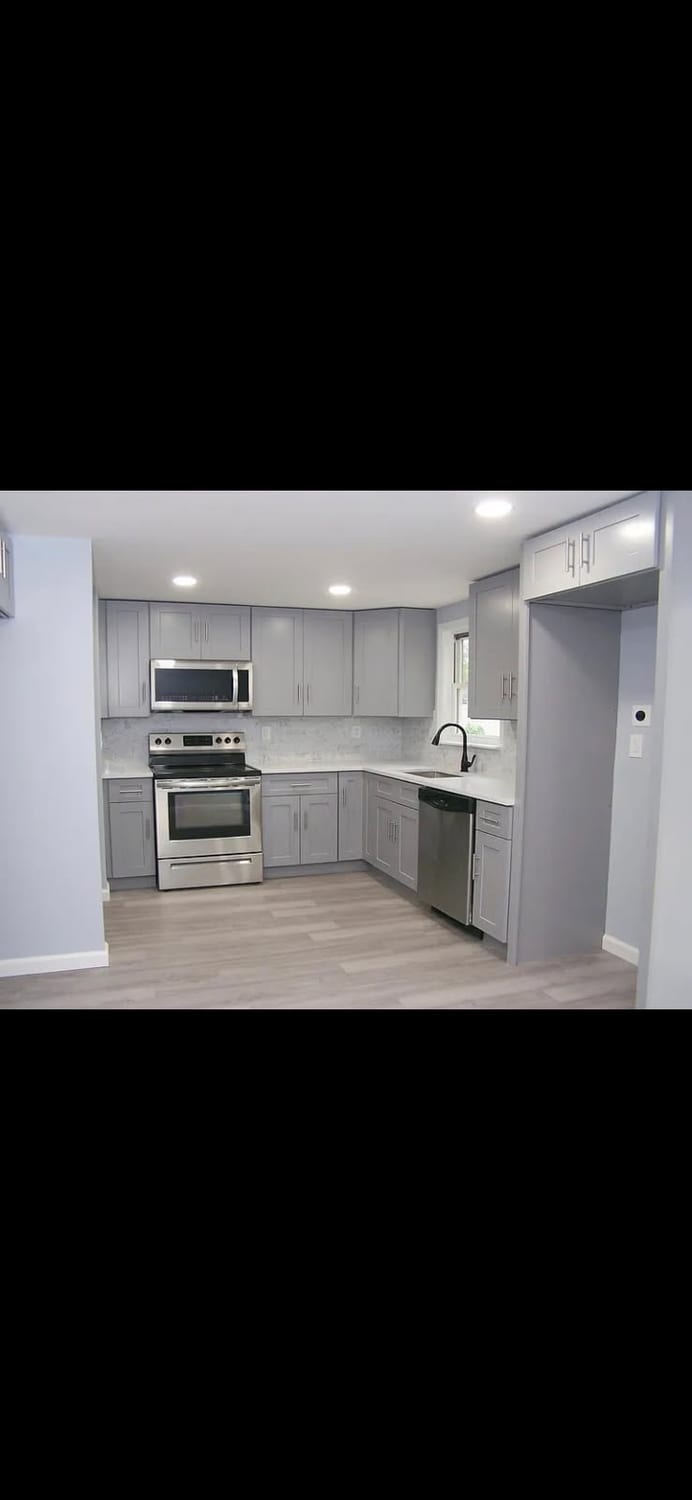 Light grey kitchen, full appliance wall — A&J Cabinet Studio install