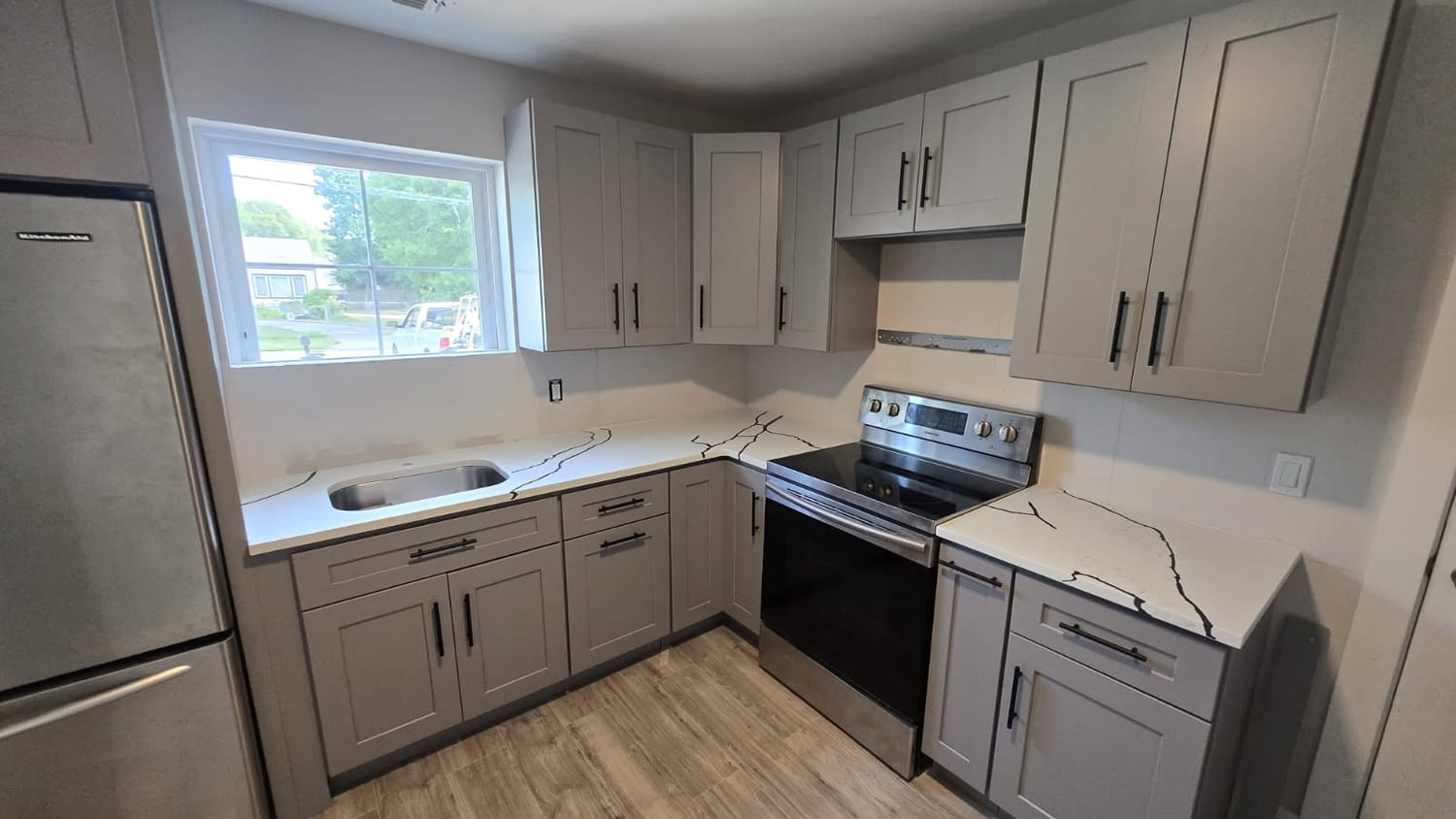 Grey shaker with veined quartz — A&J Cabinet Studio install